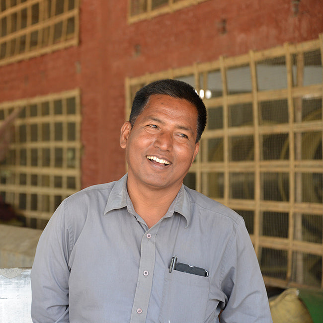 Male tea farmer laughs